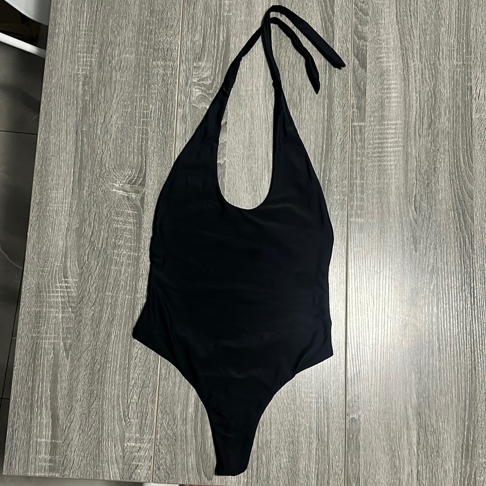 Black Women’s thong one piece bathing suit . Small - Never worn- New